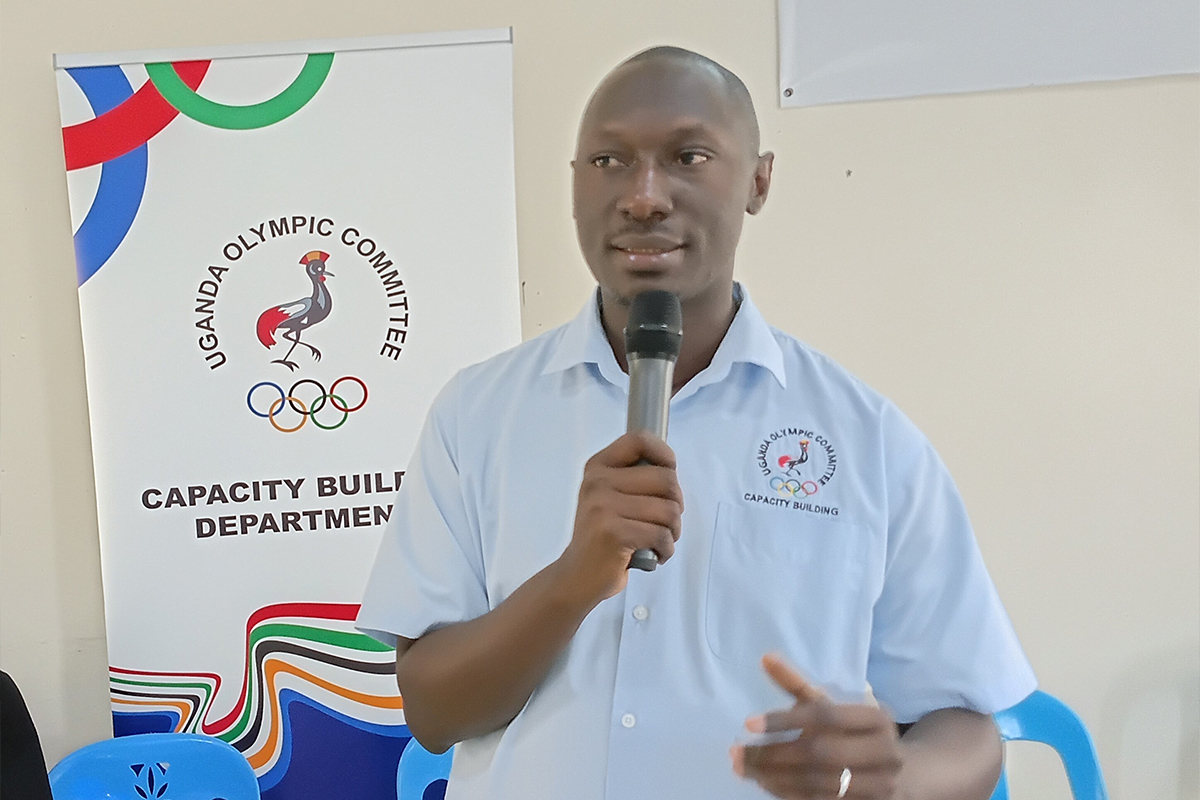 Joseph Collins Ssemmanda delivering a presentation on sportsmanship, teamwork and fair competition during the training.
