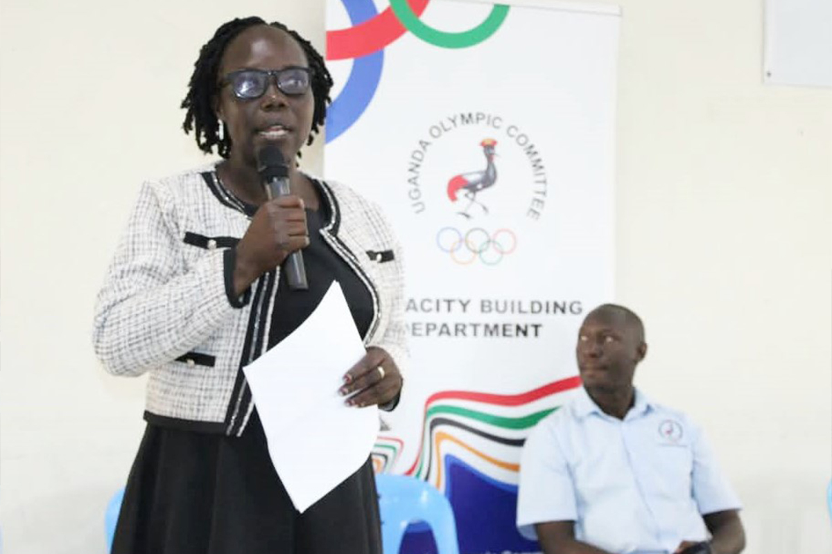 Stella Amandru addressing participants during a sports management training workshop at Muni University.